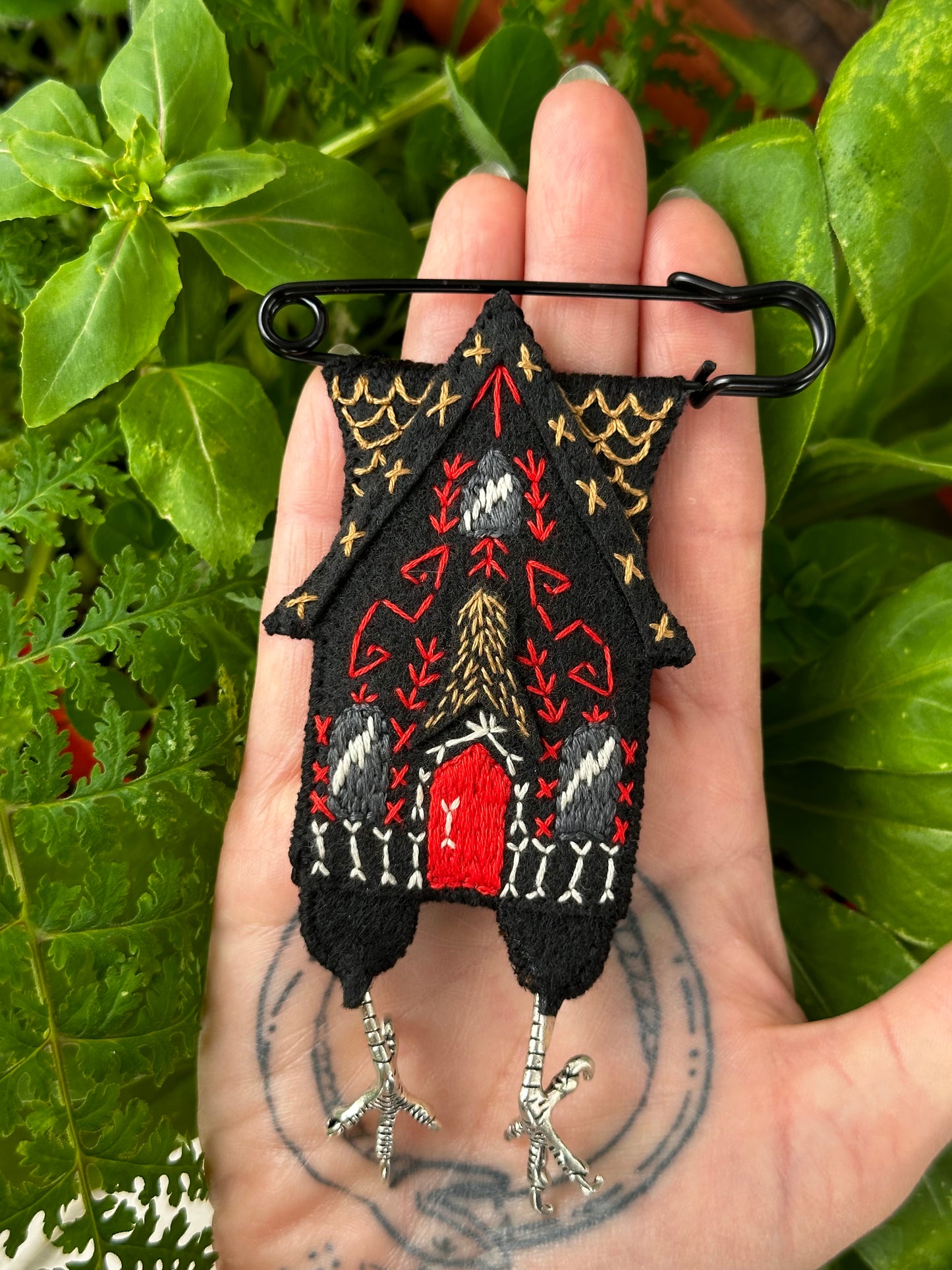 Black Baba Yaga House with Silver Feet and Red Door